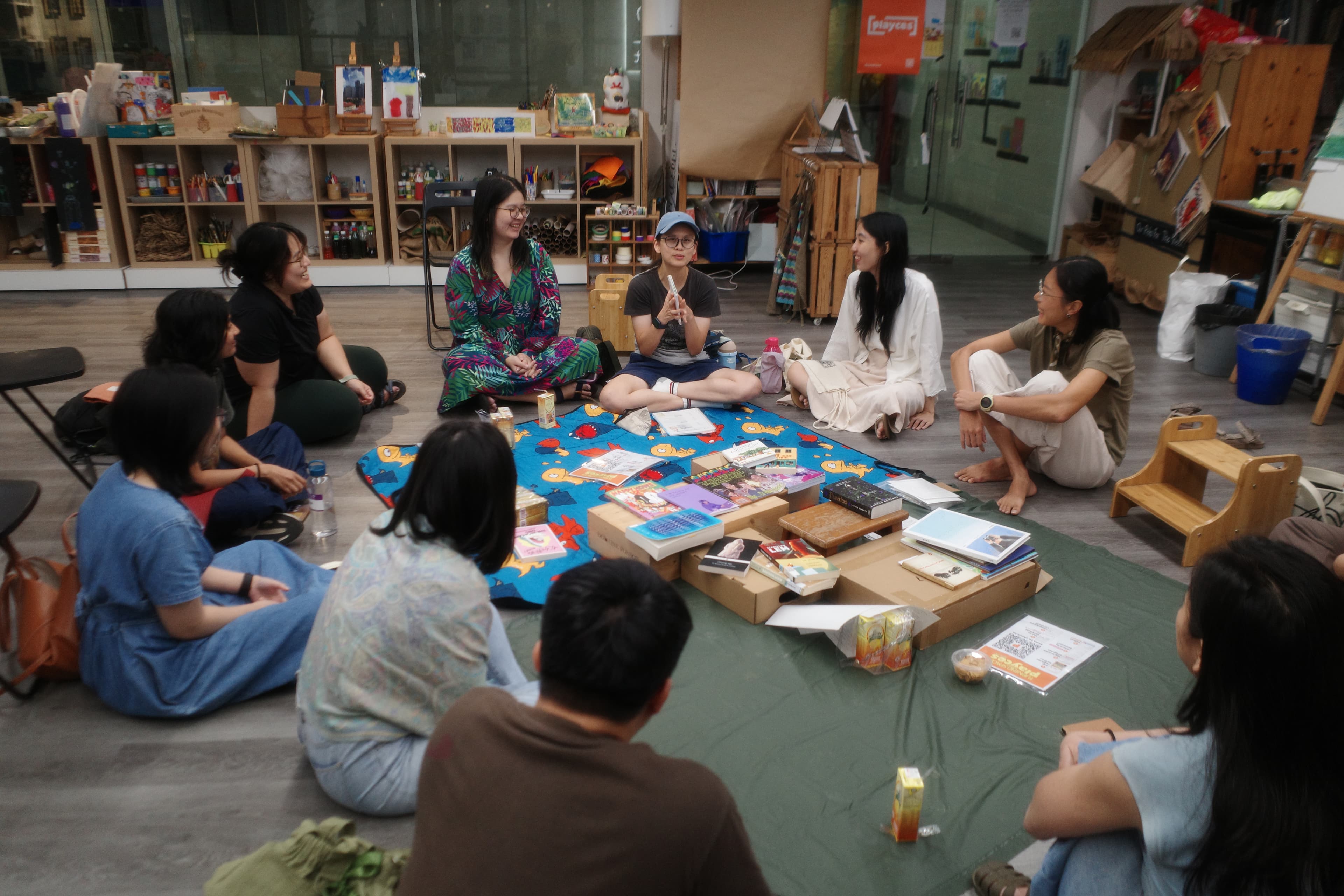 People gathering around a creative activity